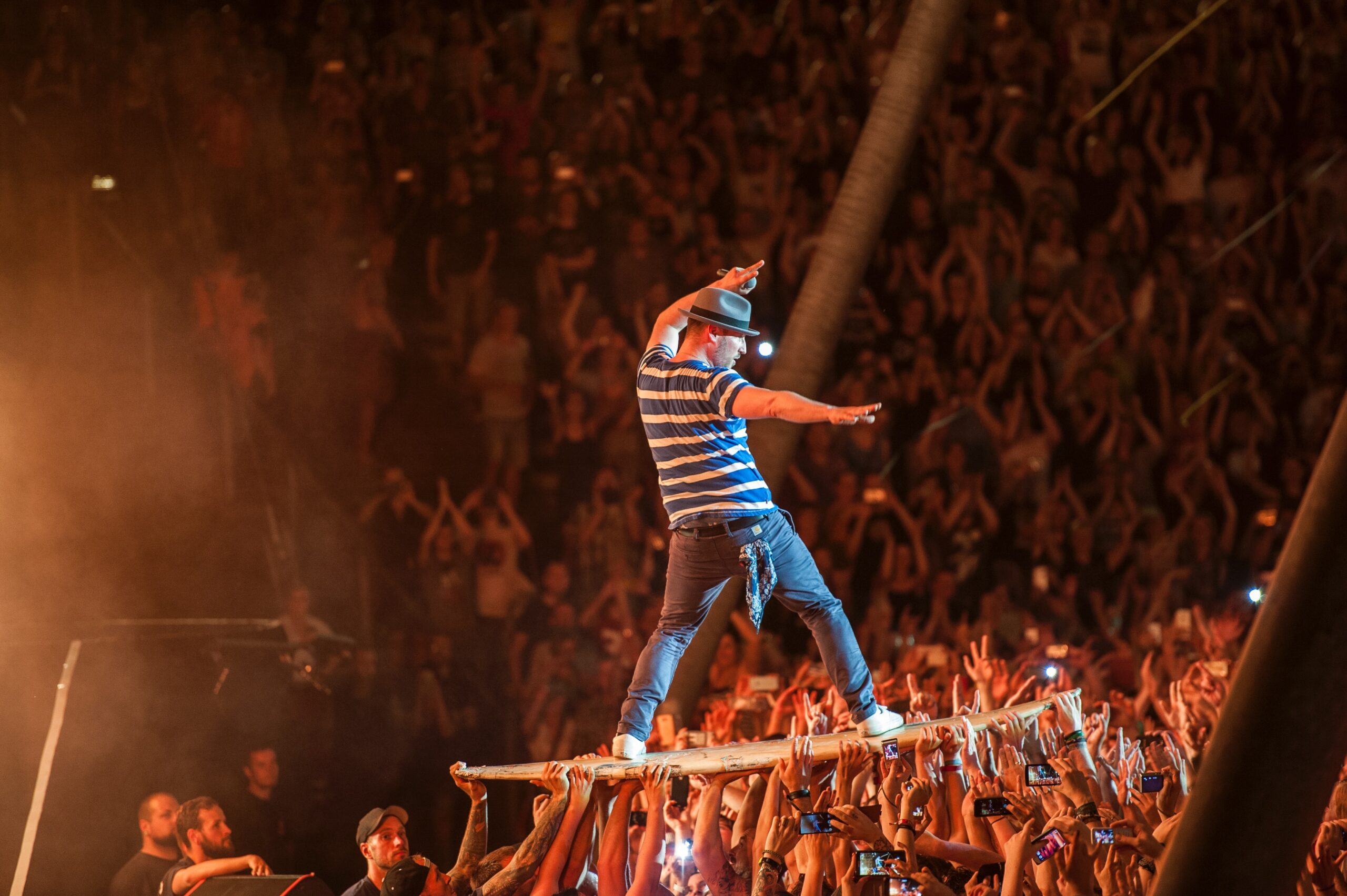 Arnim Teutoburg-Weiß, leadsinger from The Beatsteaks, is surfing the crowd during the concert at Parkbühne Wuhlheide Berlin.
